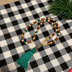 Hand assembled beaded necklace turquoise cotton tassel